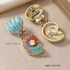 Detailed view of colorful seashell earrings with vibrant crystals and starfish tassels