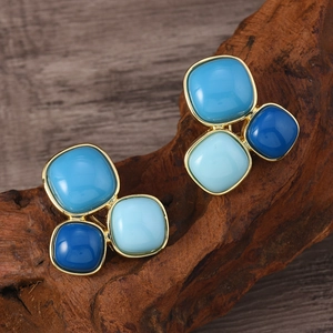 Retro palace style earrings featuring clustered blue crystals on a golden base finish