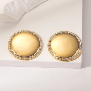 Detail of round gold stud earrings with turquoise crystal and micro-pave rhinestones