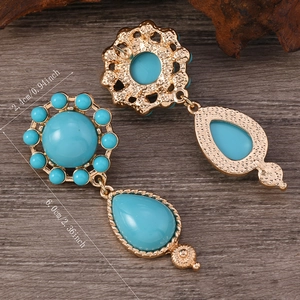 Vintage gold sunflower earrings with blue turquoise drops and measurements of 6cm length