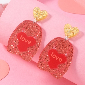 Romantic acrylic heart drop earrings with gold and red glitter featuring 'love' lettering