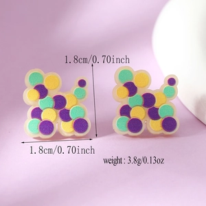 Macro shot of colorful geometric resin stud earrings showing dimensions and weight details