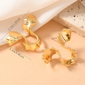 Detailed view of golden irregular lava texture earrings with dimensions of 3.1cm by 2.5cm