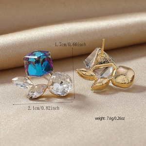 Detail view of crystal stud earrings with iridescent cube and zircons, size marked 1.7x2.1cm