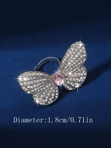 Detail view of butterfly ring with pink heart stone and 1.8cm diameter sizing