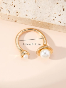 Macro shot of gold-plated pearl open ring showing 1.8cm inner diameter measurement