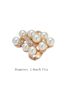 Detail view of gold floral pearl ring showing 1.8cm diameter and adjustable open band