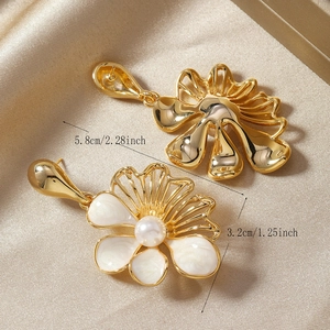 Detailed view of floral pearl earrings with dimensions 5.8cm long and 3.2cm wide