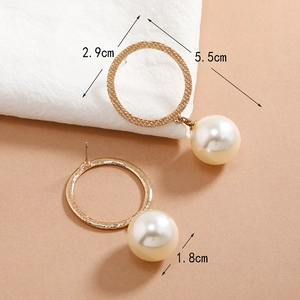 Elegant gold drop earrings with large cream pearls and textured metal hoop details