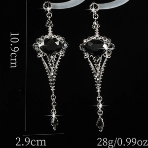 Detailed view of long black vintage earrings with 10.9cm length and 2.9cm width