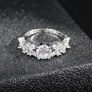 Elegant marquise cut zircon silver ring with sparkling round centerpiece on black leather