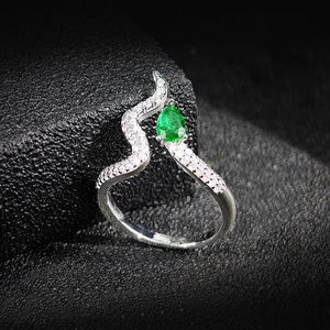 Modern S-wave silver ring with a pear-cut emerald gemstone and sparkling pavé zircons