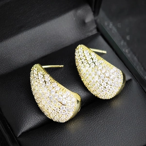 Waterdrop pave-set zircon earrings in gold finish displayed on black jewelry box