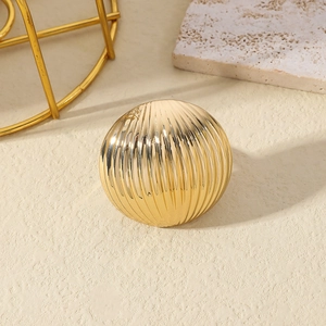 Minimalist gold plated ring with irregular vertical striped texture and metallic luster