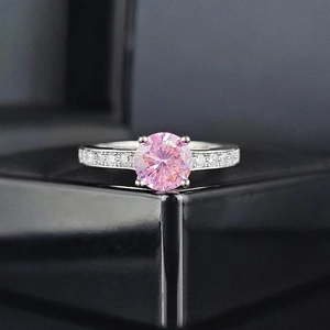 Elegant silver ring with a large round pink zircon centerpiece in a four-prong setting