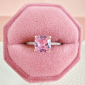 Elegant rose gold ring with a large square pink stone in a luxury velvet gift box