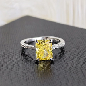 Exquisite square cut yellow gemstone ring with 14K gold mark on black leather