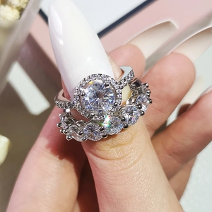 Elegant silver halo ring set with round cubic zirconia stones for wedding and anniversary