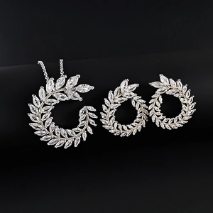 Exquisite olive leaf jewelry set with sparkling marquise-cut zircons on black background