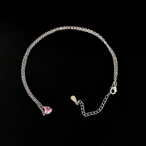 Silver double-layer necklace and ring set featuring a pink heart-shaped crystal stone