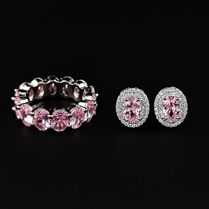 Sparkling silver jewelry set featuring pink oval zircon ring and matching stud earrings