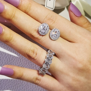 Luxe jewelry set featuring oval-cut zircon ring and stud earrings on model