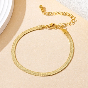 Detailed view of golden herringbone snake chain necklace with lobster clasp and extender