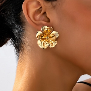 Elegant gold flower stud earrings featuring layered 3D petals and brushed metal texture