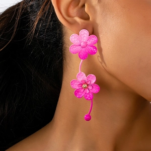 Pink oversized floral earrings with hexagon texture on metallic lacquer finish