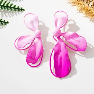 Detail of oversized floral metal earrings with pink gradient matte finish and leaf accents