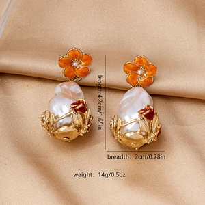 Detailed view of Baroque pearl earrings with gold finish and dimensions for daily street wear