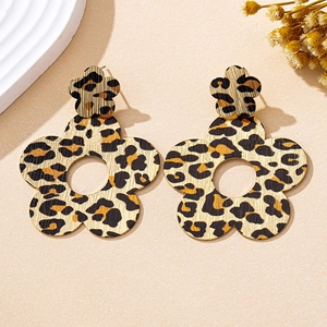 Detail shot of leopard print floral drop earrings with a textured matte finish