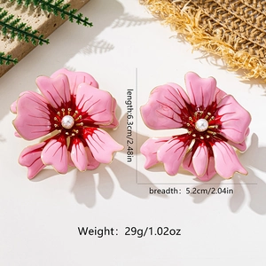 Detailed view showing dimensions of large pink floral earrings with central pearls