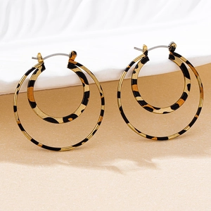 Detail of leopard print double hoop earrings with a stylish retro tortoiseshell pattern