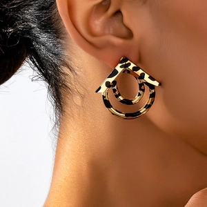 Fashionable geometric leopard print earrings with gold metallic finish and textures