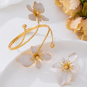 Exquisite gold floral bangle and ring set with marble textured petals for party wear