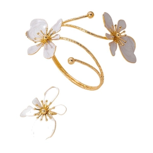 Elegant gold flower jewelry set with white enamel petal details for party and daily wear
