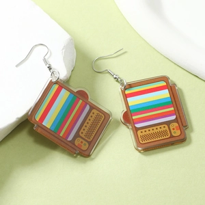 Detailed view of vintage TV acrylic earrings on textured stones with silver hooks