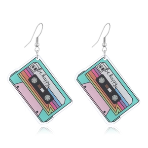 Colorful acrylic cassette tape earrings featuring Be Happy print on white background