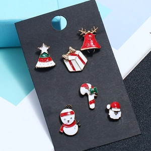 Christmas enamel earring set featuring reindeer, snowman, and Santa motifs in festive colors
