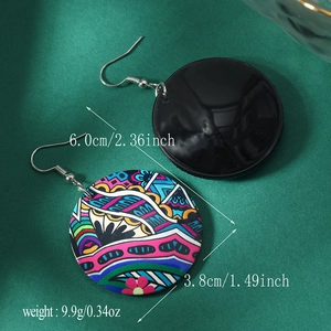Detail view of bohemian painted acrylic round earrings with size and weight specs