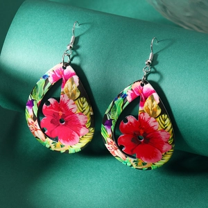 Folk style acrylic floral teardrop earrings with vibrant red hibiscus and green leaf patterns