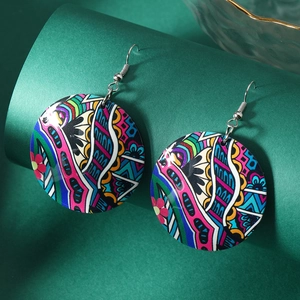 Bohemian acrylic round floral earrings with colorful abstract tribal patterns on a dark base