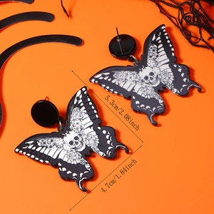 Detailed size view of dark butterfly acrylic earrings with skull and floral pattern