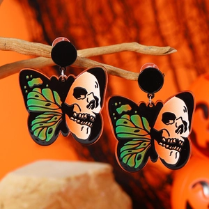 Halloween butterfly skull earrings with green wings on orange festive background