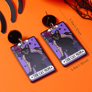 Close-up of tarot style black cat acrylic earrings with XIX and The Cat Mom text