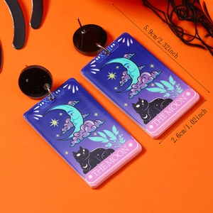 Detail view of Tarot Moon acrylic earrings featuring a black cat and stars design