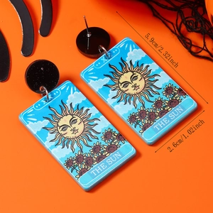 Detail of tarot card acrylic earrings with 'The Sun' print and measurement annotations