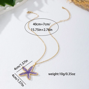 Gouden ketting met paarse zeester hanger voor een zomerse strandvakantie-look