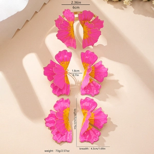 Detailed macro view of pink and yellow floral napkin rings with exact size measurements